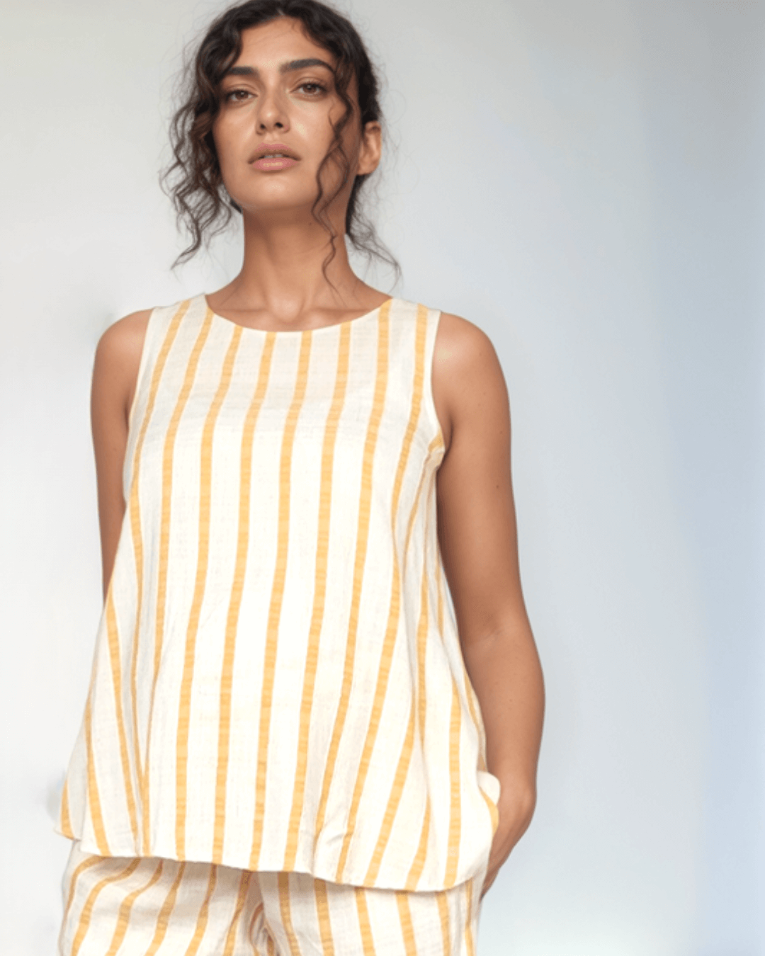 Maternity top in a a-line shape suitable for smart casual in the office or everyday wear, in a contemporary cool style and part of a matching co-ord set for pregnancy and postpartum from a high end designer brand for maternity and breastfeeding in the UK & Ireland & Switzerland & Dubai
