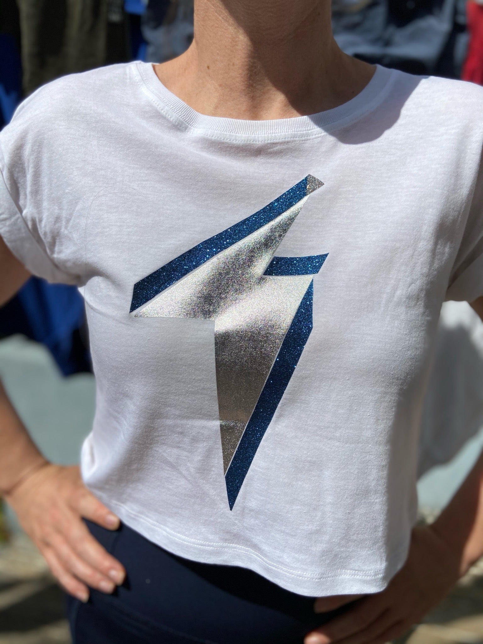 Summer cool cropped maternity t-shirt designed to sit above the bump, this is the ultimate maternity top for ‘cool mums’. Flattering boxy shape with rolled-sleeves is bump and breastfeeding friendly, and you will be wearing it long after pregnancy.