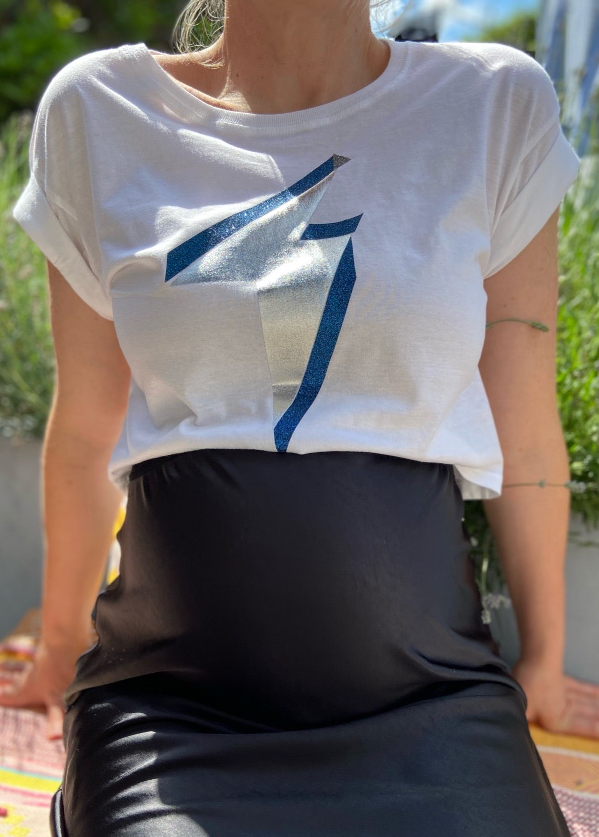 Summer cool cropped maternity t-shirt designed to sit above the bump, this is the ultimate maternity top for ‘cool mums’. Flattering boxy shape with rolled-sleeves is bump and breastfeeding friendly, and you will be wearing it long after pregnancy.