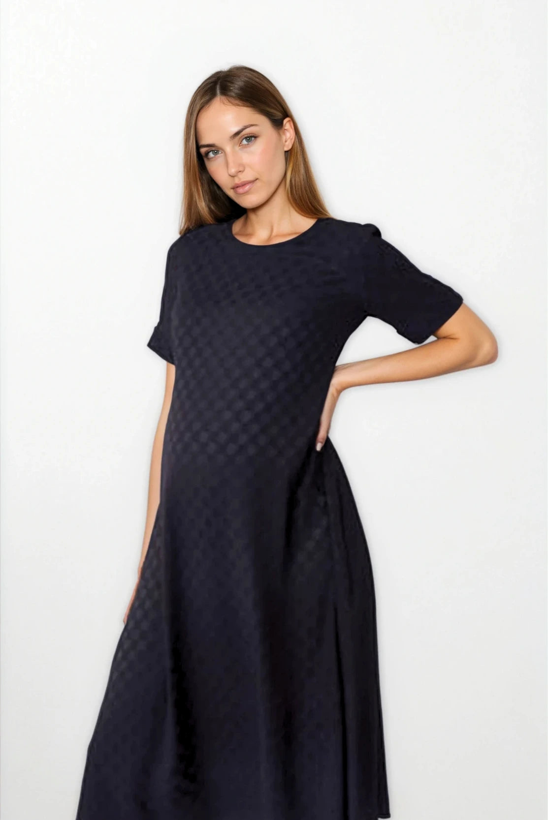 Pregnant business professional in smart elevated black dress for the office - the best maternity workwear capsule for smart style in pregnancy