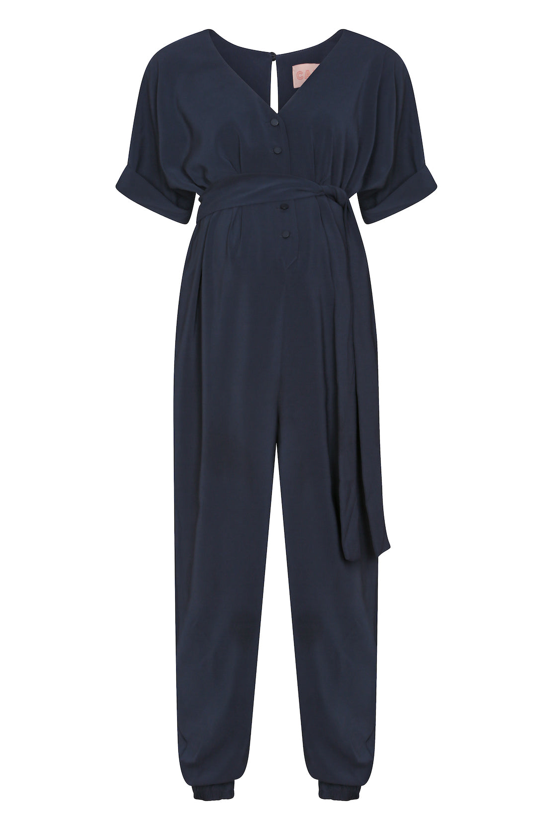 Harem-style maternity jumpsuit, your ‘must-have’ wardrobe piece for an elevated every-day or maternity workwear option. In midnight navy, it is easy to wear for pregnancy, breastfeeding and afterwards. Cleverly designed to offer versatile style options as you evolve through the stages. The V-neck and front button features ensure this is a breastfeeding-friendly jumpsuit for new mums, while the loose fit and cuffed trousers style is so flattering postpartum.